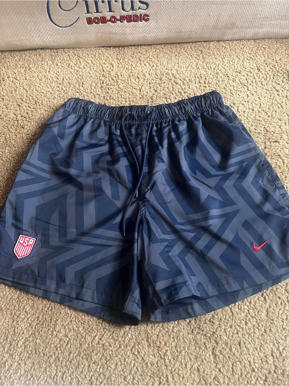 Nike Navy Blue Athletic Shorts with Dark Chevron Accents